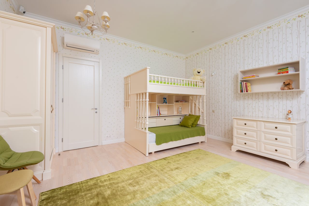 our-services-02 Bright and tidy children's bedroom featuring a modern bunk bed and green accents.